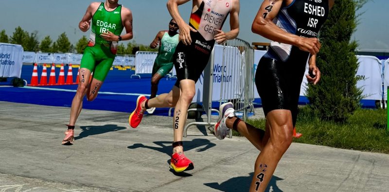 a group of men running in a race